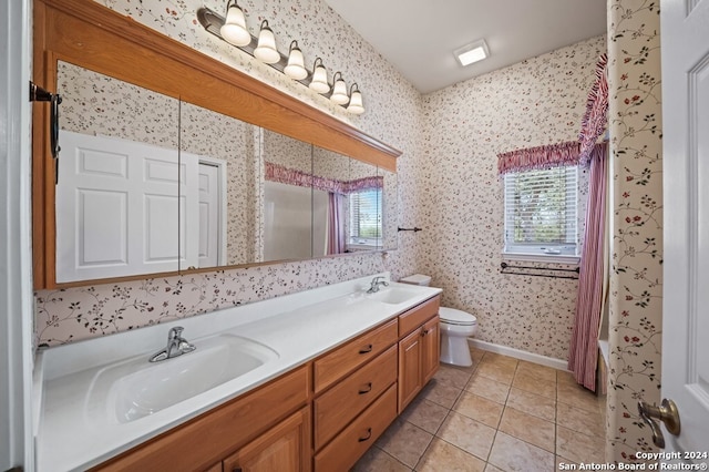 full bathroom featuring vanity, shower / tub combo with curtain, toilet, and tile patterned flooring