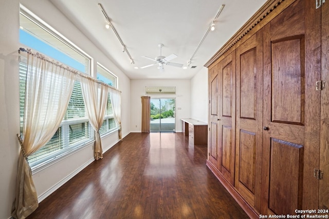 2029 Crown Rdg, Kerrville, TX 78028 - corridor with rail lighting, dark wood finished floors, and baseboards