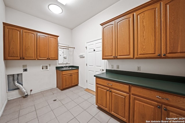 2029 Crown Rdg, Kerrville, TX 78028 - laundry area featuring hookup for a washing machine, baseboards, cabinet space, and a sink