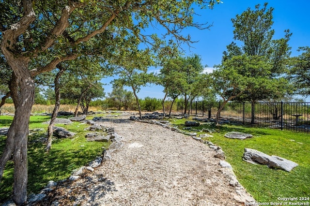 view of home's community featuring a lawn