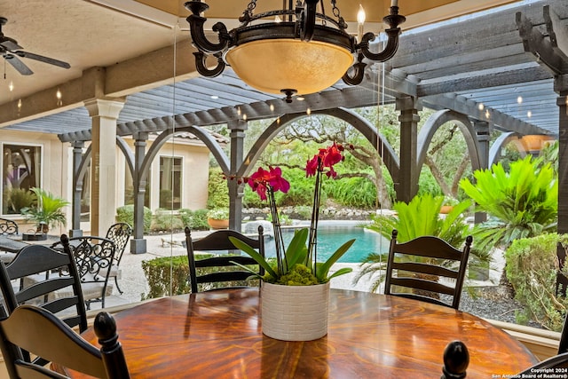 exterior space with ceiling fan, outdoor dining area, an outdoor pool, and a pergola