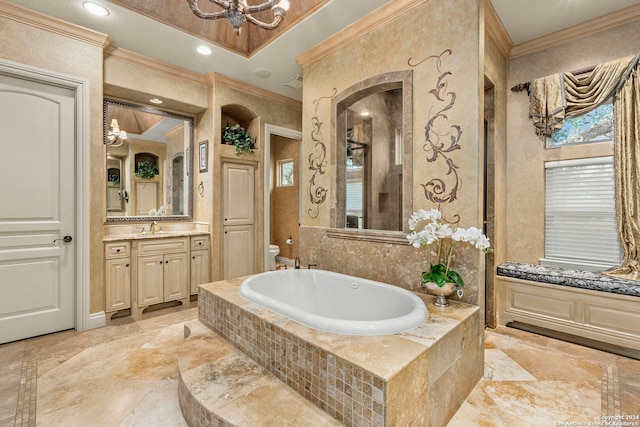 full bathroom with toilet, vanity, a bath, stone tile flooring, and crown molding