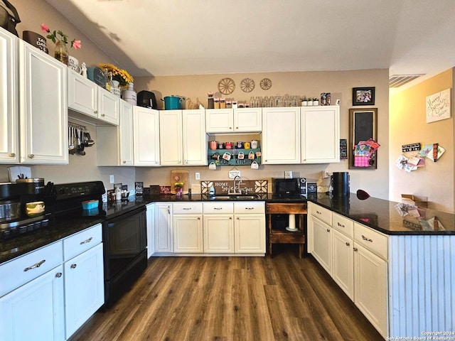 kitchen with white cabinetry, dark stone counters, black appliances, dark wood-type flooring, and sink