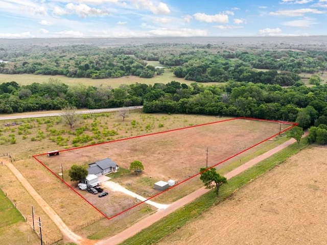 birds eye view of property with a rural view