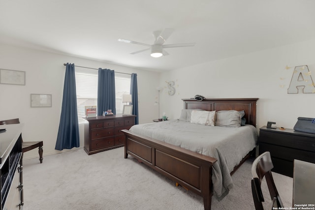 bedroom with light colored carpet and ceiling fan