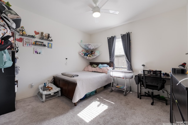 carpeted bedroom featuring ceiling fan