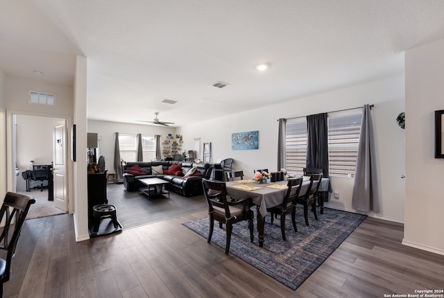 dining space with dark hardwood / wood-style floors and ceiling fan