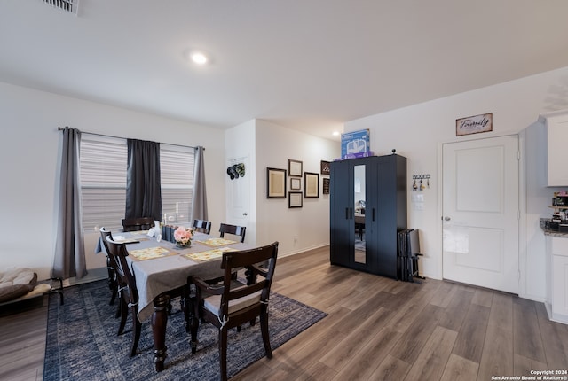 dining area featuring dark hardwood / wood-style floors