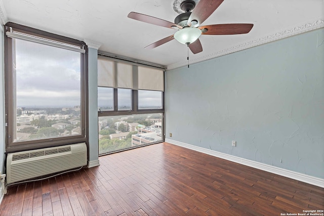 empty room with ceiling fan, an AC wall unit, and dark hardwood / wood-style floors