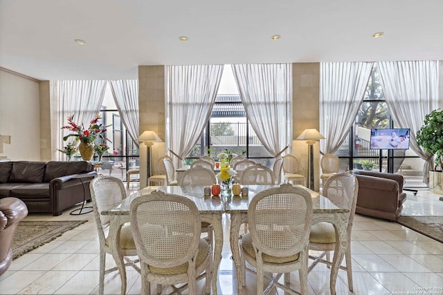 dining area featuring light tile patterned flooring