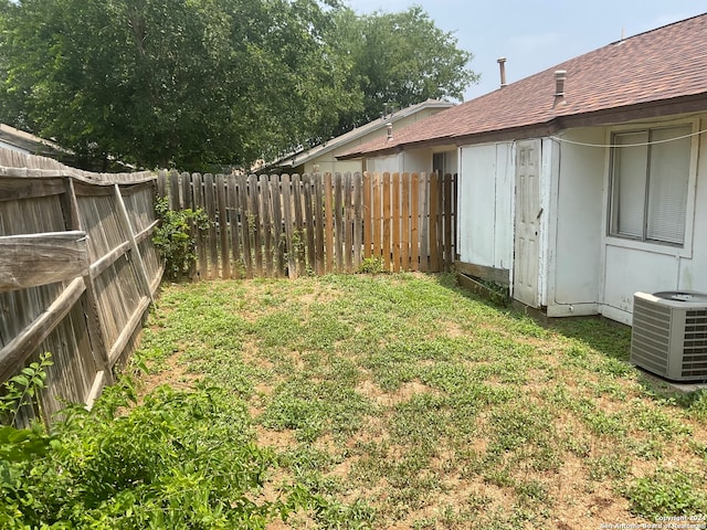 view of yard with central air condition unit