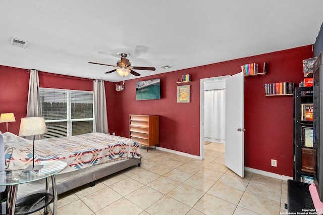 bedroom with ceiling fan and light tile patterned floors