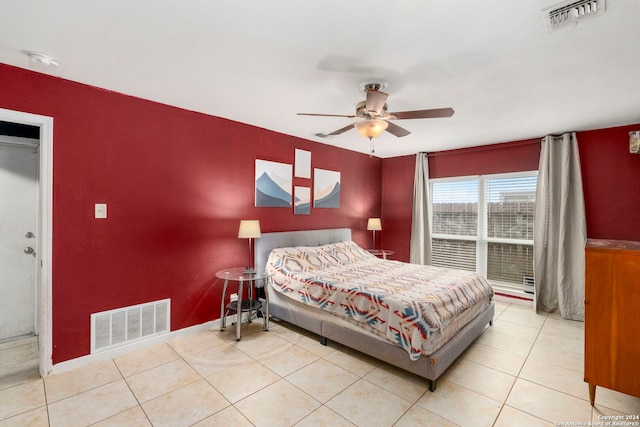 bedroom with ceiling fan and light tile patterned flooring