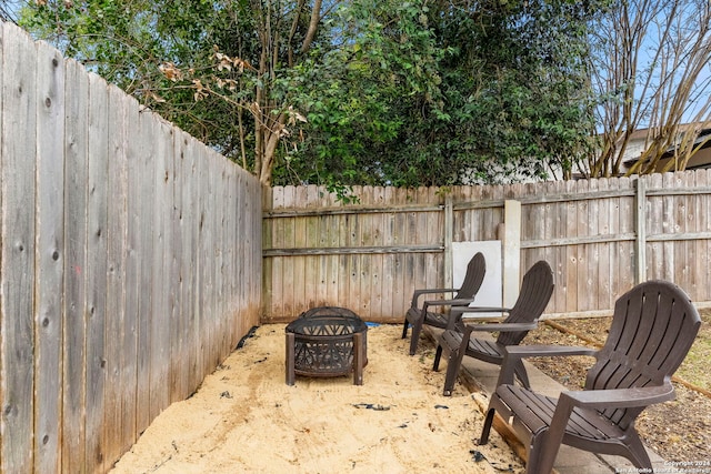 view of patio with an outdoor fire pit