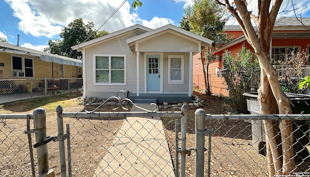 bungalow-style home featuring cooling unit