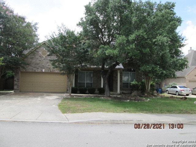 obstructed view of property featuring a garage