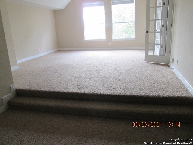 spare room featuring carpet flooring