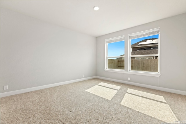 empty room with carpet flooring