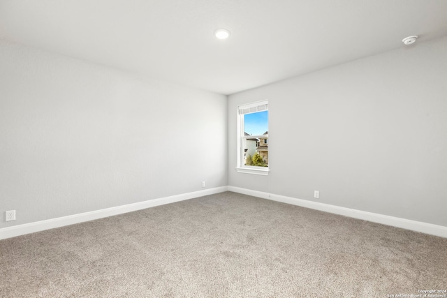 empty room featuring carpet flooring