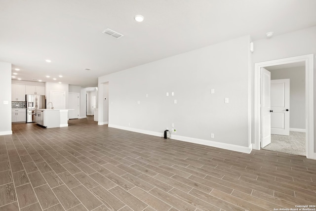 unfurnished living room featuring light hardwood / wood-style floors