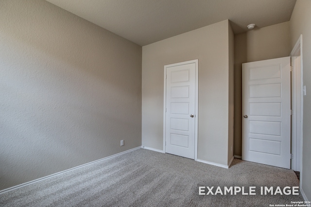 unfurnished bedroom featuring carpet flooring