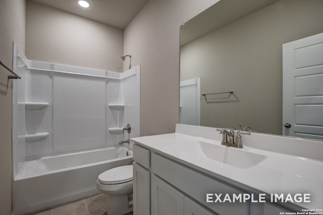 full bathroom with washtub / shower combination, a textured ceiling, toilet, vanity, and tile patterned flooring