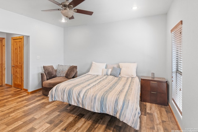 bedroom featuring light wood-type flooring and ceiling fan