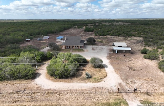 858 Ranch Rd 187, Sabinal, TX 78881 - view of front of property with a shingled roof, dirt driveway, a chimney, and a porch