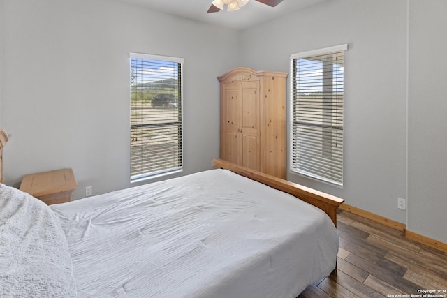 858 Ranch Rd 187, Sabinal, TX 78881 - bedroom featuring baseboards, ceiling fan, and wood-type flooring
