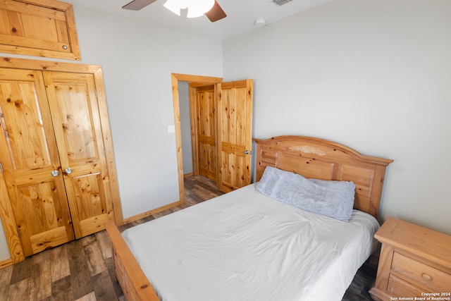 bedroom featuring a closet, ceiling fan, and dark hardwood / wood-style flooring