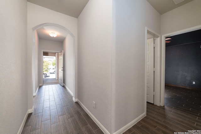 corridor featuring dark wood-type flooring