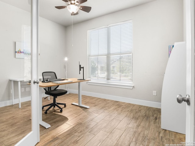 office space with light hardwood / wood-style flooring and ceiling fan