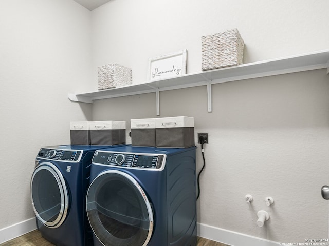 laundry room featuring hardwood / wood-style floors and separate washer and dryer