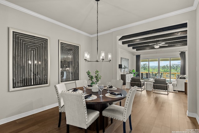 dining space featuring beamed ceiling, crown molding, wood-type flooring, and ceiling fan with notable chandelier