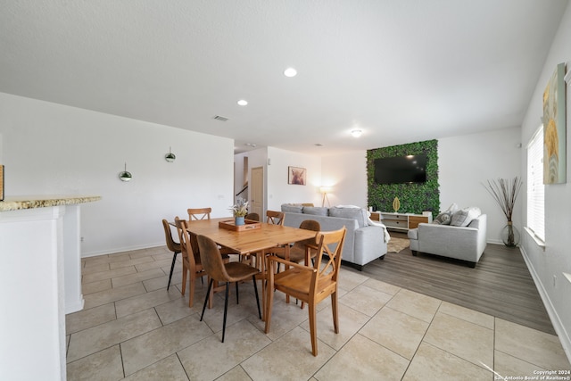 dining space with light wood-type flooring