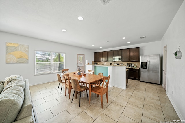 dining room featuring light tile patterned floors