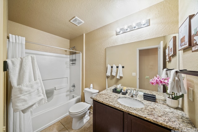 full bathroom with shower / bathing tub combination, a textured ceiling, toilet, vanity, and tile patterned flooring