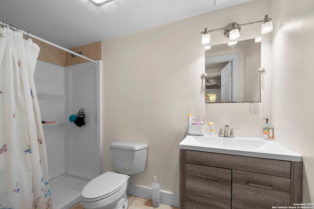 full bathroom with a shower stall, toilet, tile patterned flooring, and vanity