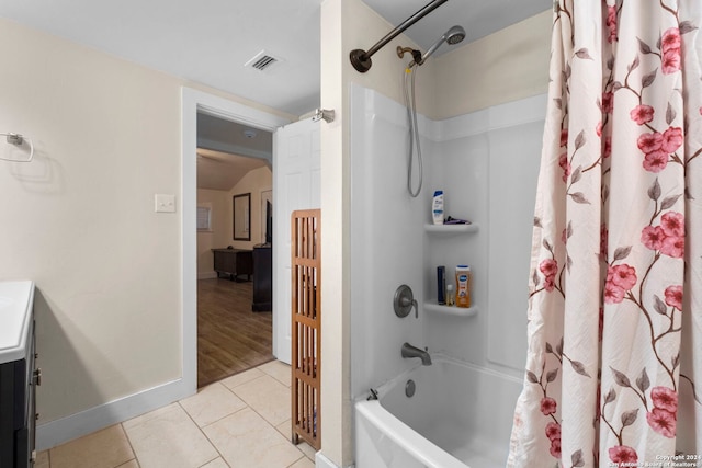 full bath with vanity, visible vents, baseboards, tile patterned flooring, and shower / tub combo with curtain