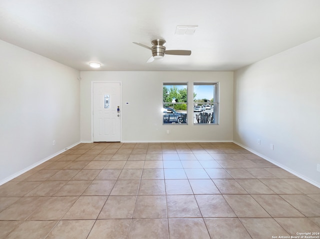 entryway featuring ceiling fan and light tile patterned floors