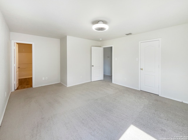 empty room featuring light carpet