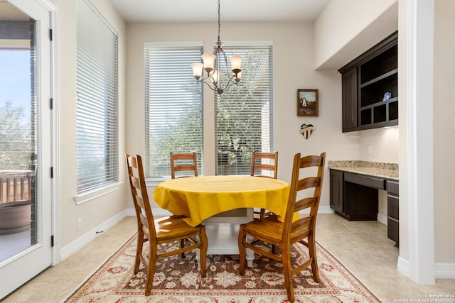 tiled dining area featuring a notable chandelier