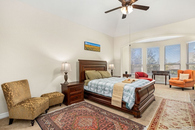 carpeted bedroom featuring ceiling fan and vaulted ceiling