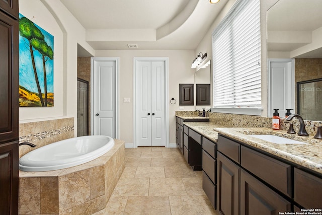 bathroom featuring vanity and plus walk in shower