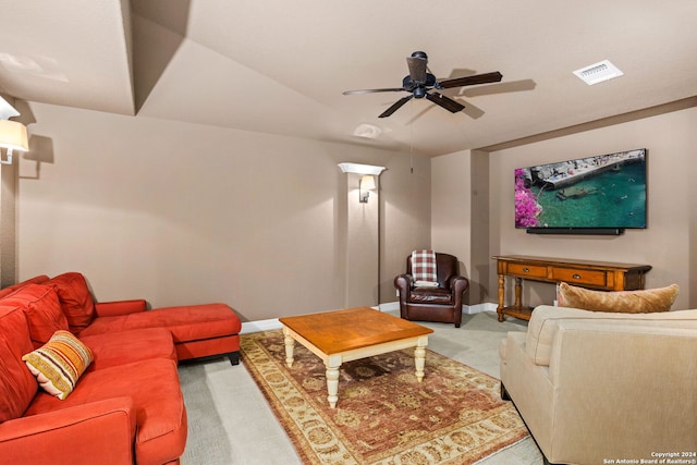 carpeted living room with ceiling fan