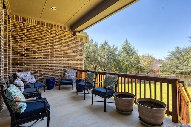 balcony with a patio area and an outdoor living space