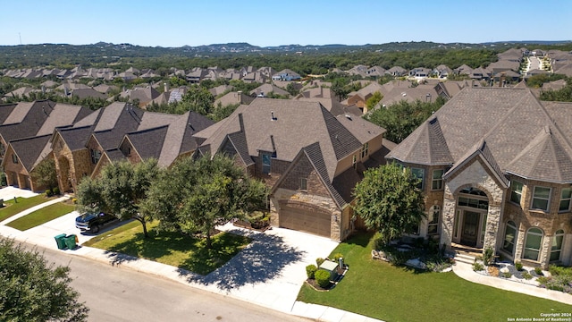 birds eye view of property featuring a mountain view