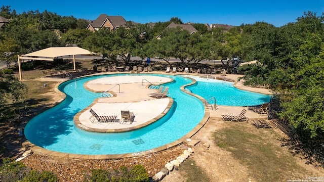 view of swimming pool with a patio