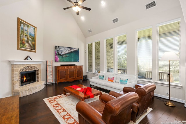 living room featuring ceiling fan, high vaulted ceiling, dark hardwood / wood-style flooring, and plenty of natural light