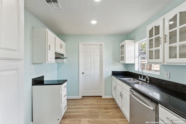 kitchen featuring white cabinetry, light wood-type flooring, sink, and stainless steel dishwasher